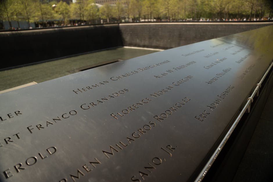 Names engraved in bronze representing legacy and commitment